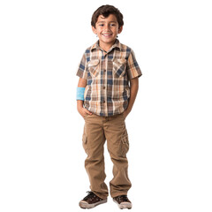 Fototapeta premium Young boy is standing with his hands in his pockets, smiling