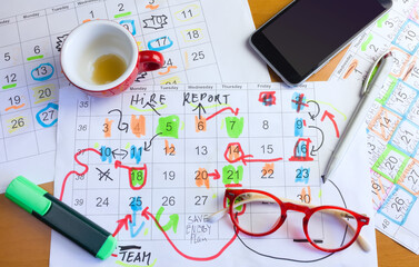 Calendar with business appointments,pens,coffee cup and spectacles, monthly schedule. Business concept,beat the clock. © Thomas Bethge