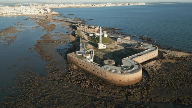 Captivating aerial capture of the Avanzada de Santa Isabel at sunset, Cadiz, Andalusia, south Spain
