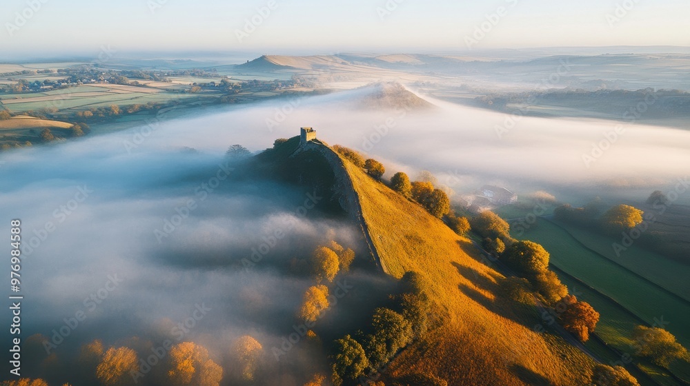 Wall mural A view of a foggy landscape with hills and trees, AI