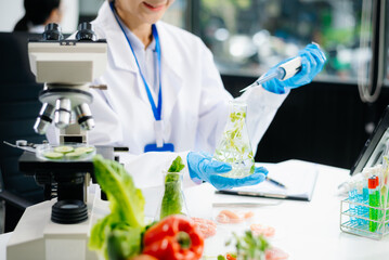 Fototapeta premium Food scientists in lab coats, testing samples, and analyzing food safety and quality
