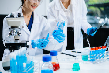 Fototapeta premium Female Scientists Conducting Chemistry Research in Modern Laboratory