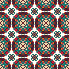 A vibrant, intricate pattern featuring floral and geometric designs in rich colors, suitable for textile or wallpaper design.