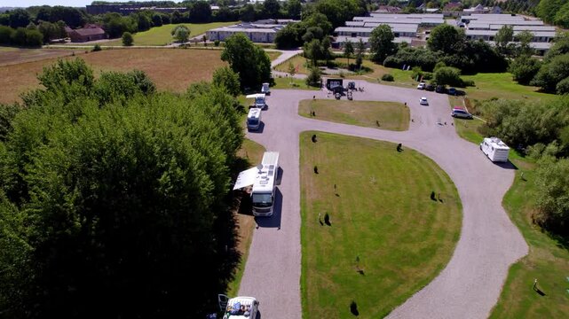 Aerial shot of a camping area in Haderslev, Denmark, nestled within nature and small town.
