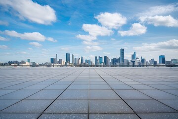 Flat platform with square tiles overlooking city skyline, blue sky, fluffy clouds