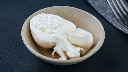 Fresh soft white burrata, ball buttery cheese, made from a mix of mozzarella and ricotta cream