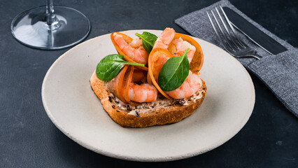 Bruschetta with beef slices, capers, cherry tomatoes, parmesan cheese, parsley.