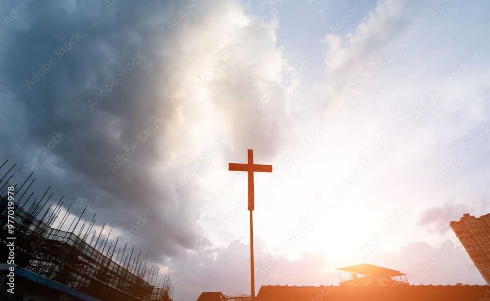 Canvas Prints a cross with unfinished building under sky