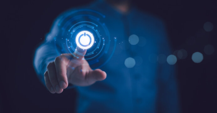 Businessman pressing power button concept. Digital technology touch screen. Hardware equipment concept. Start or shut down concept.
