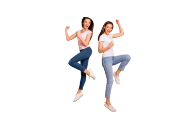 Full length body size view portrait of nice charming attractive cheerful overjoyed satisfied slim fit straight-haired girls having fun victory triumph isolated on bright vivid shine yellow background