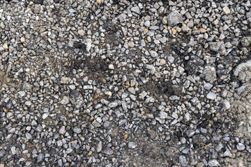 dirty gravel textured ground cover before road working asphalt making construction process basic layer