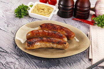 Delicous natural roasted sausages in the plate