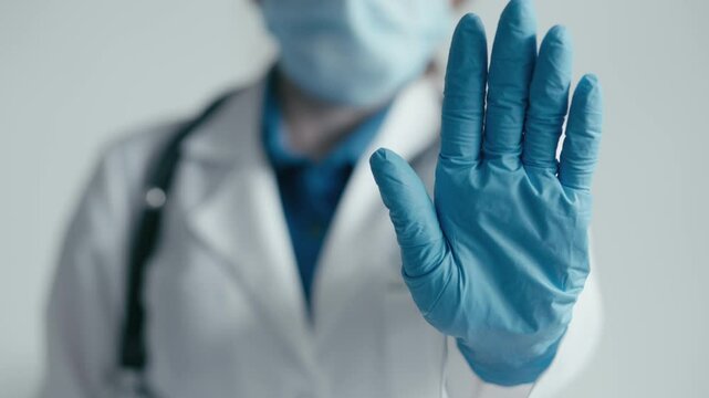 Safety is a top priority in healthcare, with medical staff using stop signals while wearing protective gear in clinics, hospitals, and emergency settings to ensure health and hygiene