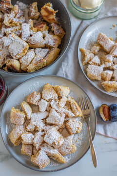 Austrian cuisine. Torn pancake (or omelet) kaiserschmarrn with honey, powdered sugar