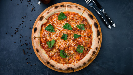 Italian pizza with cheese, greens and spices.