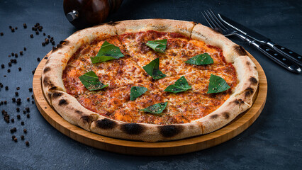 Italian food pizza with cheese, greens and spices.