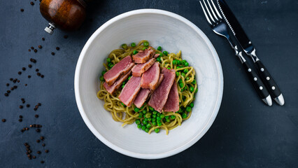 Lunch pasta with seared tuna and green peas.