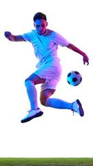 Naklejka premium Focused football player, in training session, works on controlling ball with neon-lit background, demonstrating precision and athleticism. Concept of championship, sport events, final game. Ad