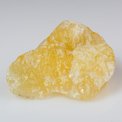 Vibrant Raw Yellow Calcite Crystal Gemstone on Soft Gray Background