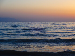 Obraz premium Sunset over Calm Sea