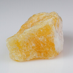 Vibrant Yellow Calcite Crystal on Reflective Surface for Mineral Collection