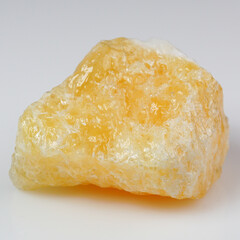 Radiant Yellow Calcite Stone in Pristine Isolation Capturing Natural Beauty and Texture