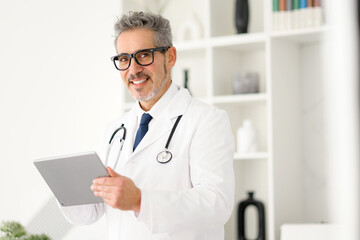 Cheerful doctor interacting with a tablet, embodying the blend of personal touch and technological advancement in medicine. The organized office promoting a sense of trust and modernity