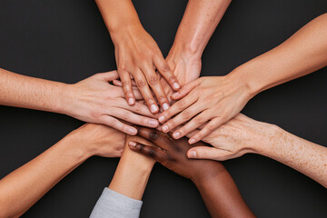a diverse group of hands coming together in a circle, symbolizing unity and shared purpose