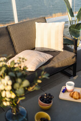 Outdoor patio furniture with pillows and flowers