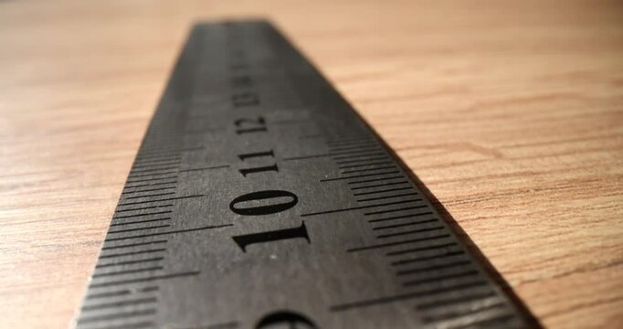 Metal construction ruler in millimeters on table. Measurement and measurements