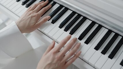 Close-up image of hands playing piano keys, showcasing musical talent and skill in a bright, elegant setting. Perfect for themes of music, creativity, and art. Close-Up of Hands Playing Piano Keys