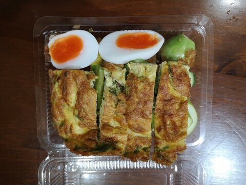 Thai food, omelet with chaom vegetables, boiled egg, rice mixed with chili paste with fried egg and boiled egg.