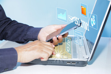 ISO 27001 concept. requirements, certification, management. Businessman choose ISO 27001 on virtual screen for information security management system (ISMS).