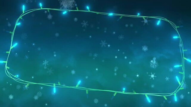 Frame of flashing blue string lights over falling snowflakes, trees and night sky