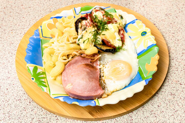 Fried Egg with Sausage and Pasta on a Plate