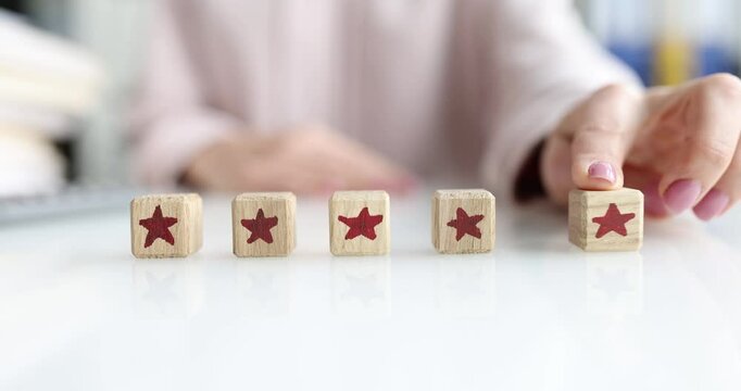 Person leaves review on product and adds fifth star. Service quality and customer recommendation concept