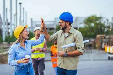 Construction Team Celebrating Success with High Five