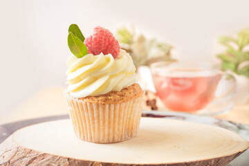 Cupcake with Cream and Raspberry