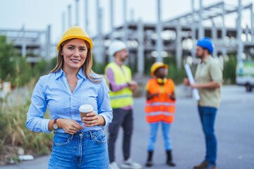 Confident Female Engineer at Construction Site with Team