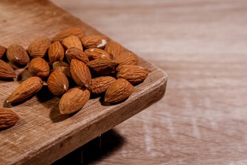 Almonds on a wooden cutting or chopping board