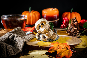 Autumn Decor with Scarves, Pumpkins, Candles, and Yellow Leaves