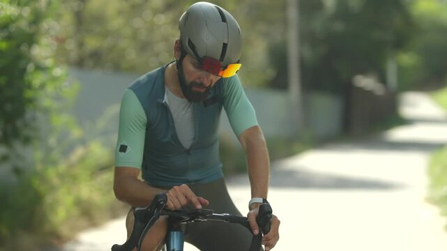 Cyclist using bike computer for building training route