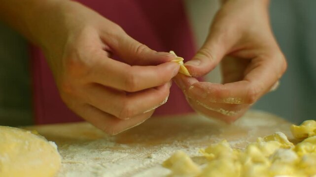 Cooking homemade ravioli pasta . Tortellini Mediterranean food 