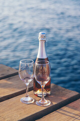 Wine in a glass on the seashore. Selective focus.