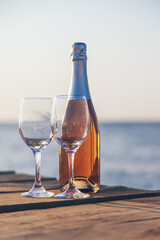 Wine in a glass on the seashore. Selective focus.
