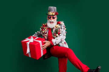 Photo of extravagant pensioner christmas gift cylinder hat decorated outfit isolated on dark green color background