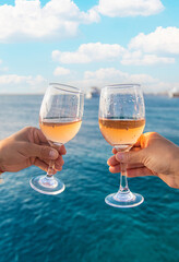 Wine in a glass on the seashore. Selective focus.