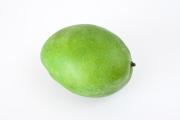 a green mango is on a white background close up