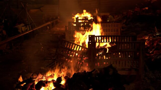 Hindu cremation ground at Manikarnika Ghat on the banks of holy River Ganga at night, Maha Smashaan, the cremation grounds, Varanasi