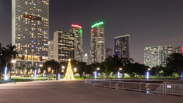 Night time lapse of a Christmas tree in Bayfront Park and skyline of downtown Miami Florida